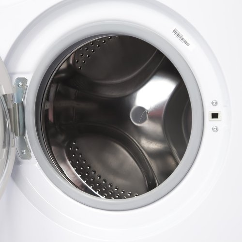 Indesit IWUD 4105 стальной перфорированный барабан вид через открытый люк