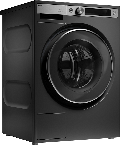 Asko W7096XG вид спереди под углом &mdash; минималистичный тонкий корпус чёрного цвета, панель управления вверху